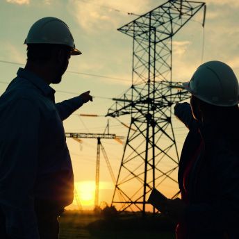 Two people meeting outside at dusk