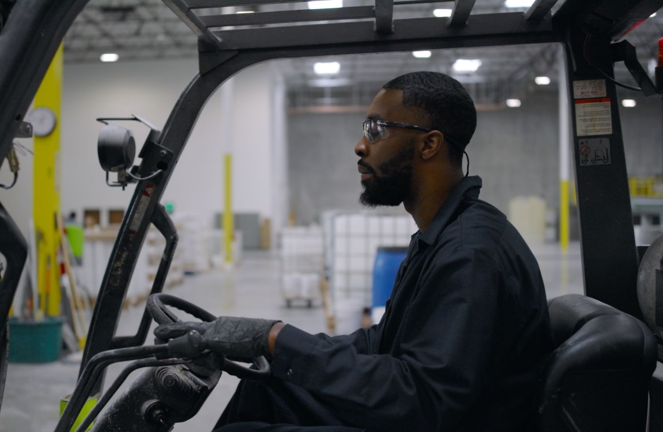 A man operating a fork lift