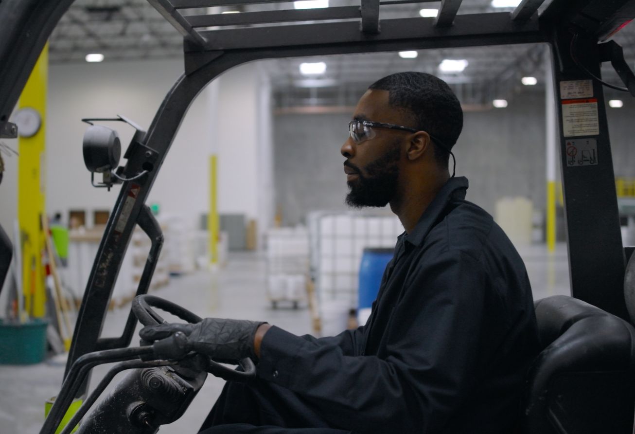 A man operating a fork lift