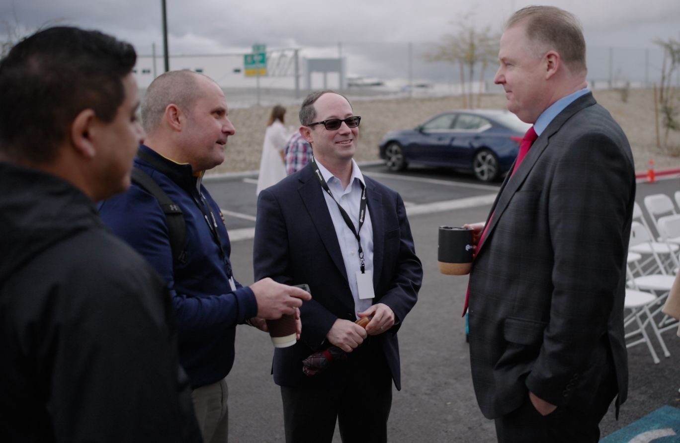 A meeting between four people outside